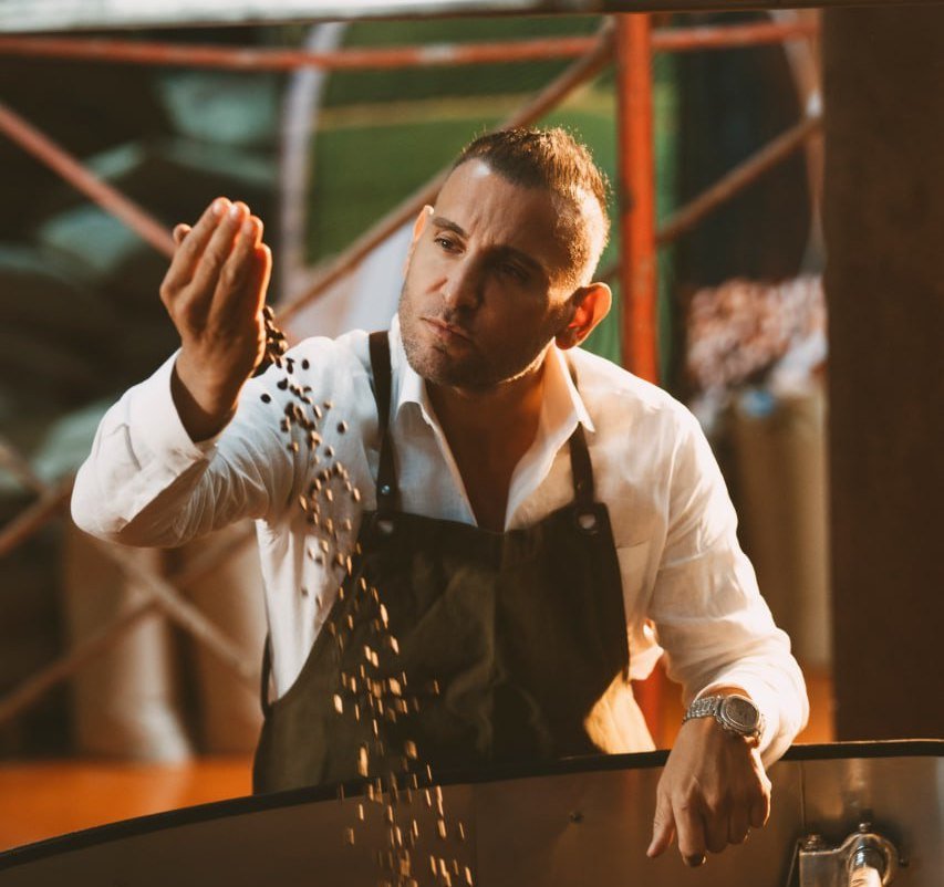 MRJade Checking coffee beans in his plant